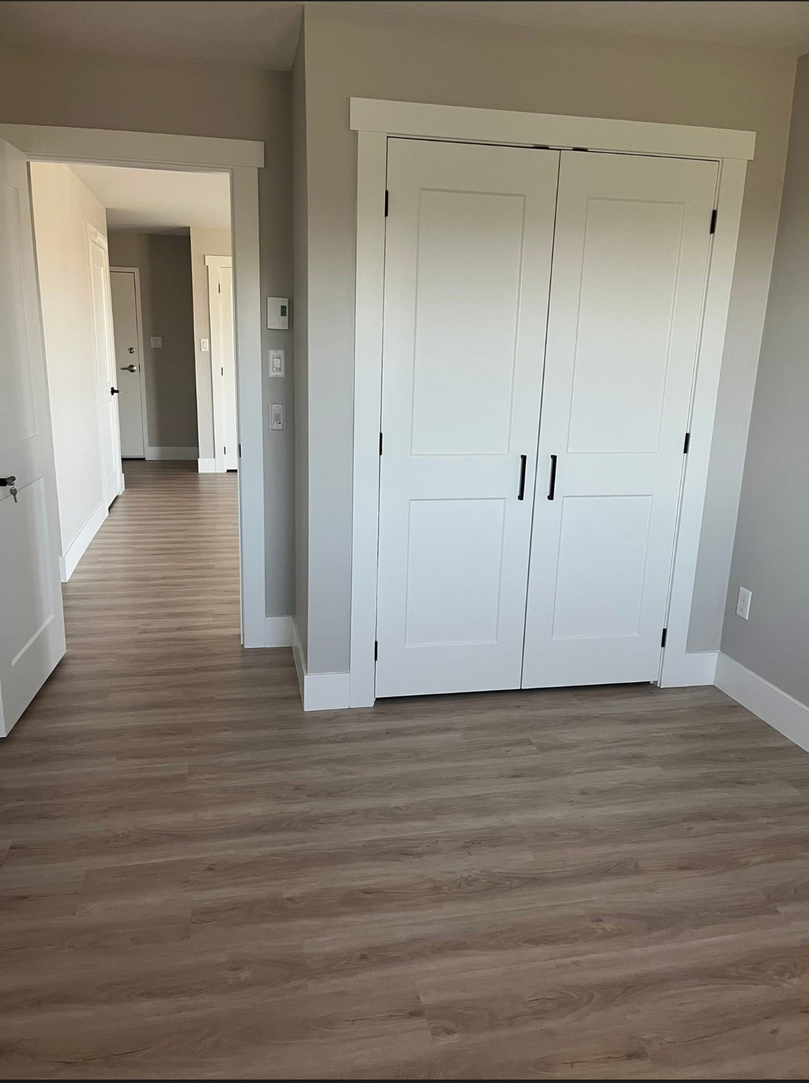 Hallway leading to the bedrooms in a 204 Bellevue Heights unit
