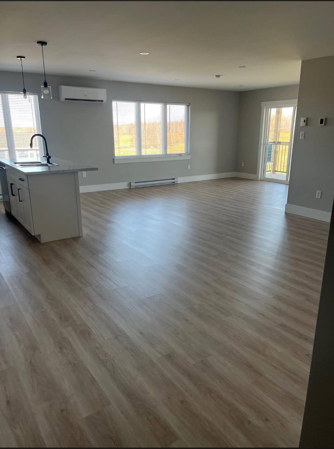 Open concept living room in a 204 Bellevue Heights unit